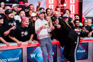 Daniel Weinman with his all-star rail after the Main Event win - when Phil Hellmuth arrived there were 35 bracelets watching Weinman