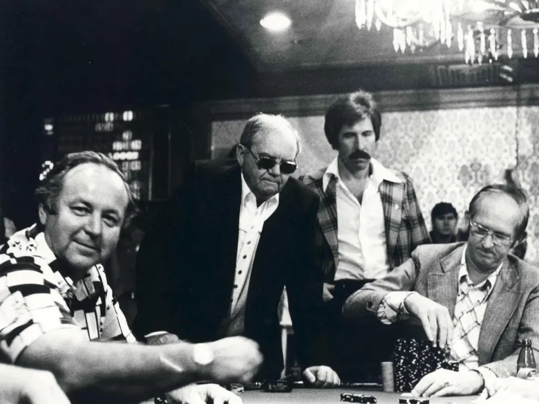 Benny Binion, in black jacket with sunglasses, watches the table action at the World Series of Poker in the Horseshoe Hotel and Casino, circa 1974 or 1976. A young Steve Wynn stands behind him. (UNLV Special Collections, Binion's Horseshoe Collection)