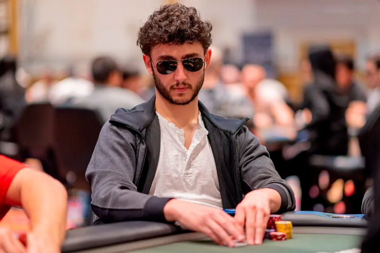 Aleksejs Ponakovs, a professional poker player from Riga, Latvia, sits confidently at a poker table, surrounded by chips and cards.