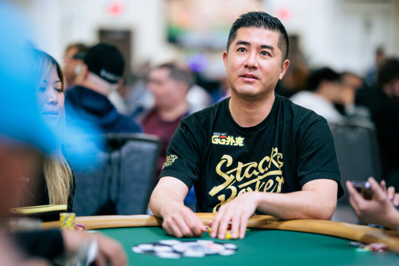 A shot of Andy Tsai at the 2019 WSOP Main Event, seated among other players at the iconic Las Vegas poker tables.