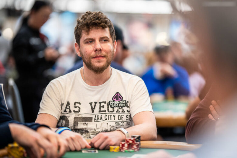 Ari Engel, known as "BodogAri," sits at a poker table in a Las Vegas casino, concentrating on his cards.