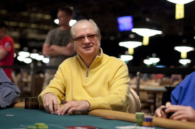 Billy Baxter at a poker table, focused on his hand of cards, exuding confidence and experience.