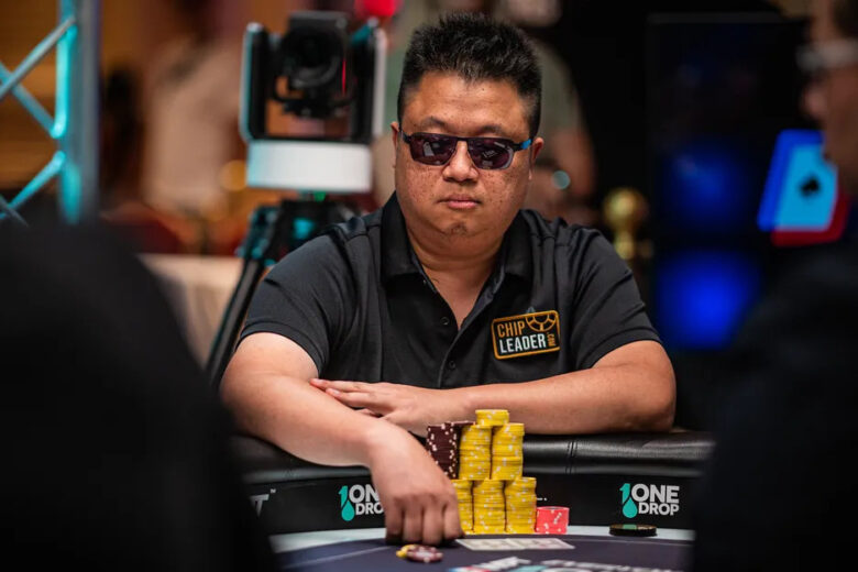 Bin Weng focused at a poker table in Atlantic City, surrounded by competitors.