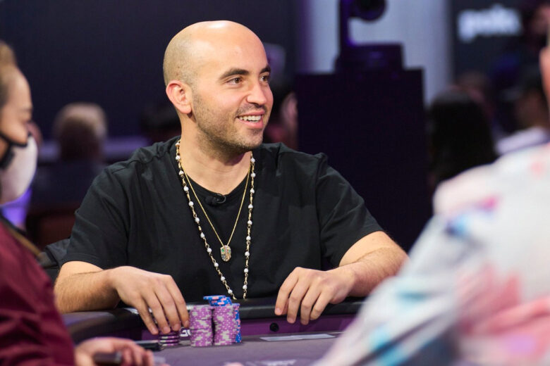 Bryn Kenney with a backdrop of the Poker's All-Time Money List leaderboard. 