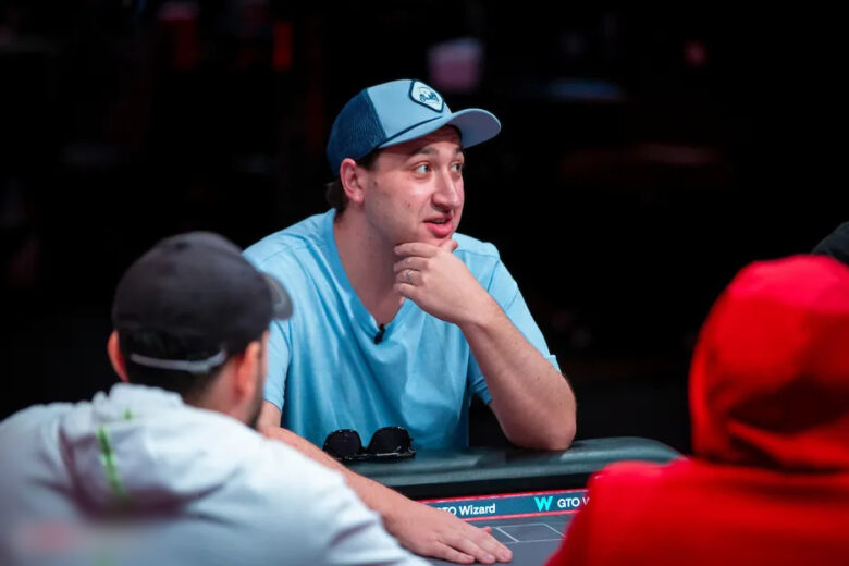 A dynamic shot of Jordan Griff in action during a live poker event, engaging with fellow players.